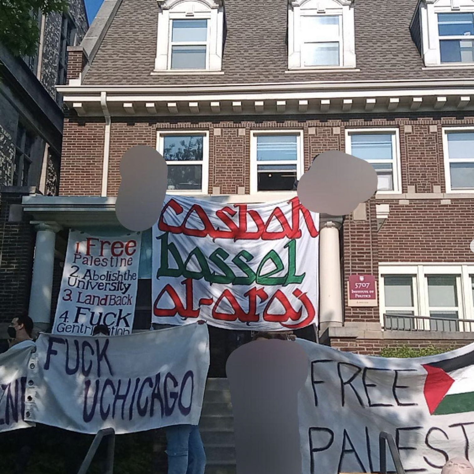The occupied Institute of Politics building at University of Chicago, temporarily the Casbah Basel al-Araj, with various banners. They read "casbah bassel al-araj", "Fuck UChicago", "Free Palestine", and the demans "1. Free Palestine 2. Abolish the University 3. Land Back 4. Fuck Gentrification 5. Fuck 12"